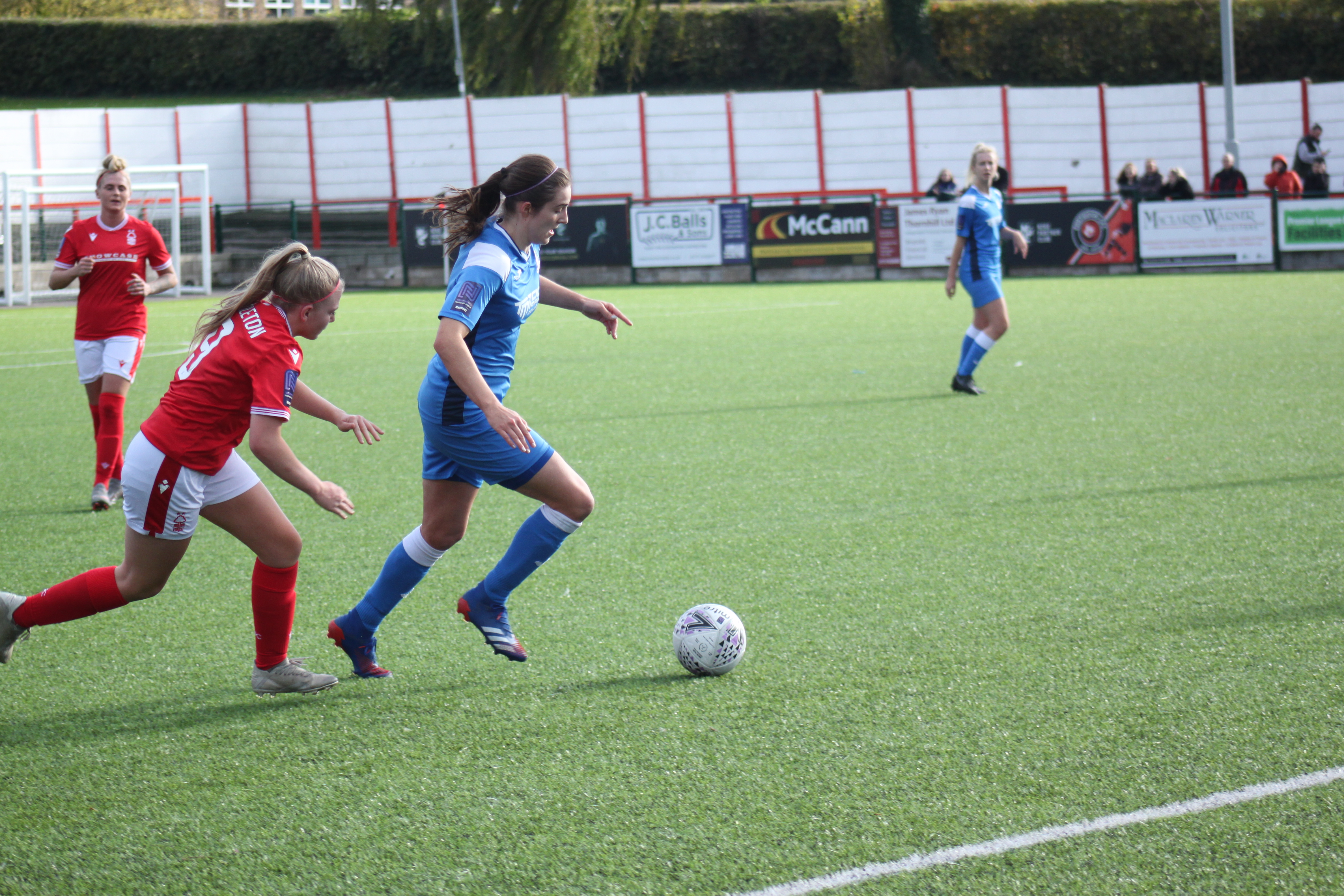 Becky Mcgrother runs past Notts Forest player