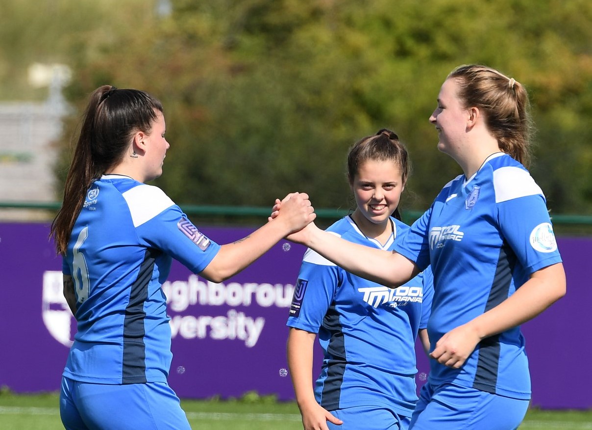 Hicks and Marshall celebrate as Totty looks on